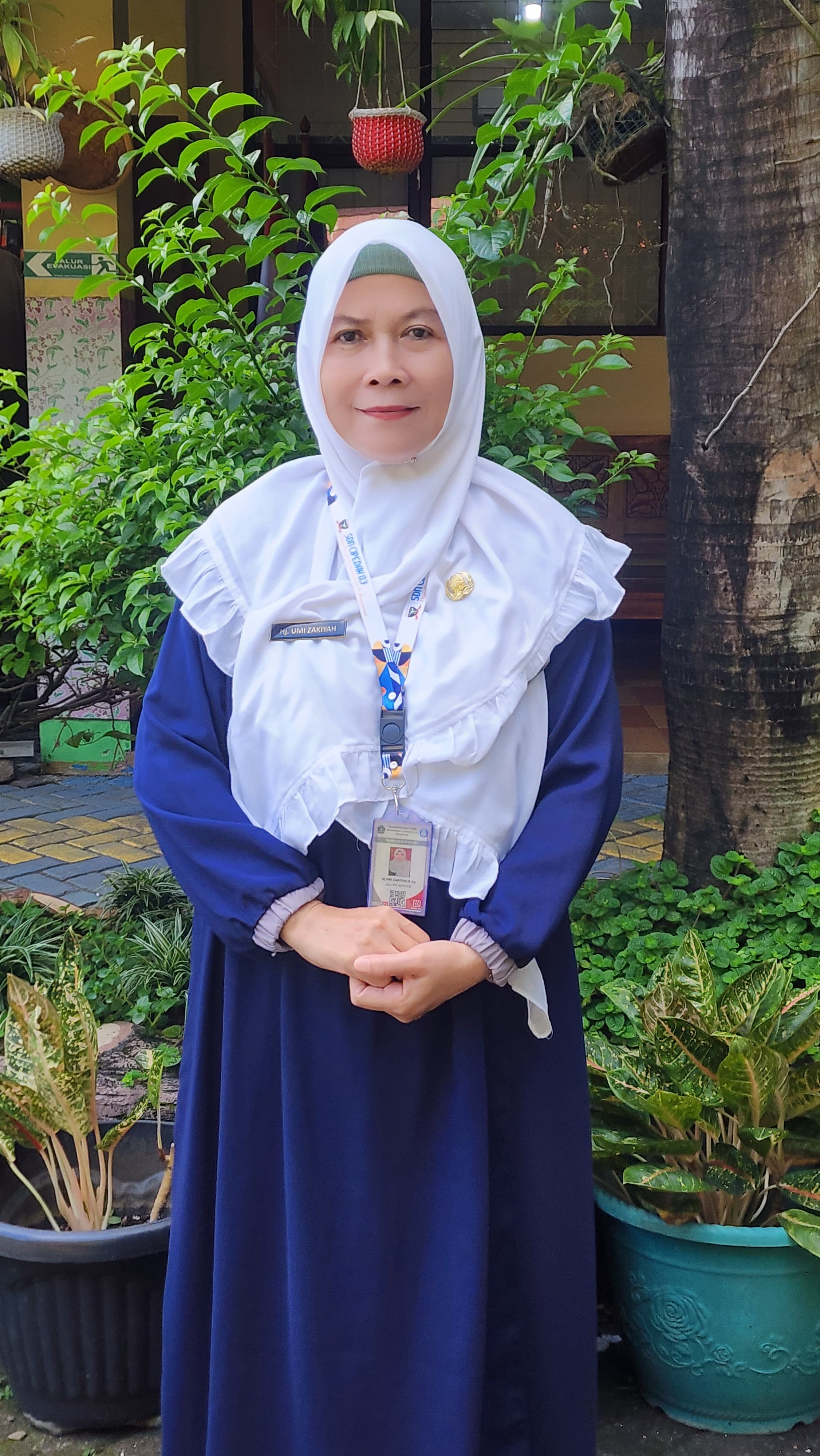 Hj. UMI ZAKIYAH, S.Ag